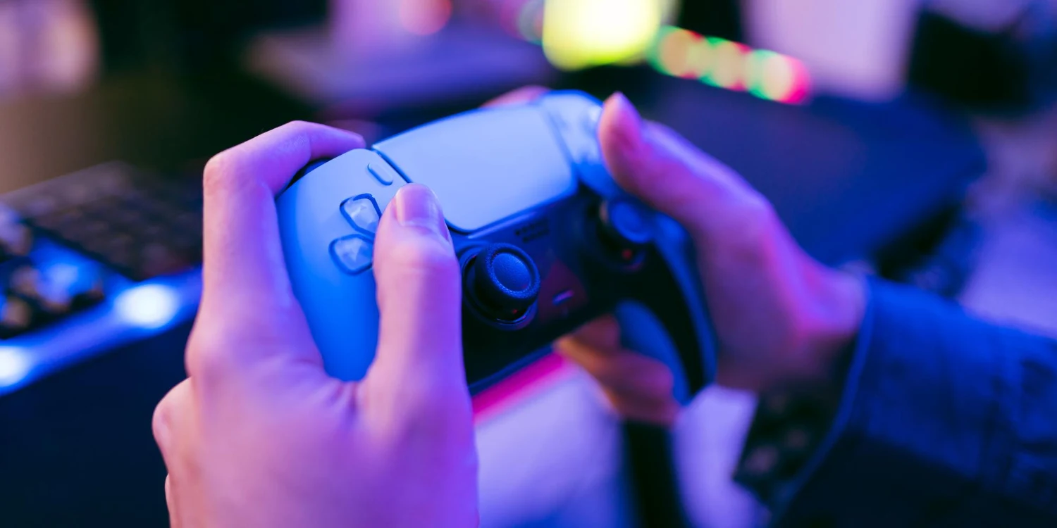 Hands hold Playstation 5 Joystick